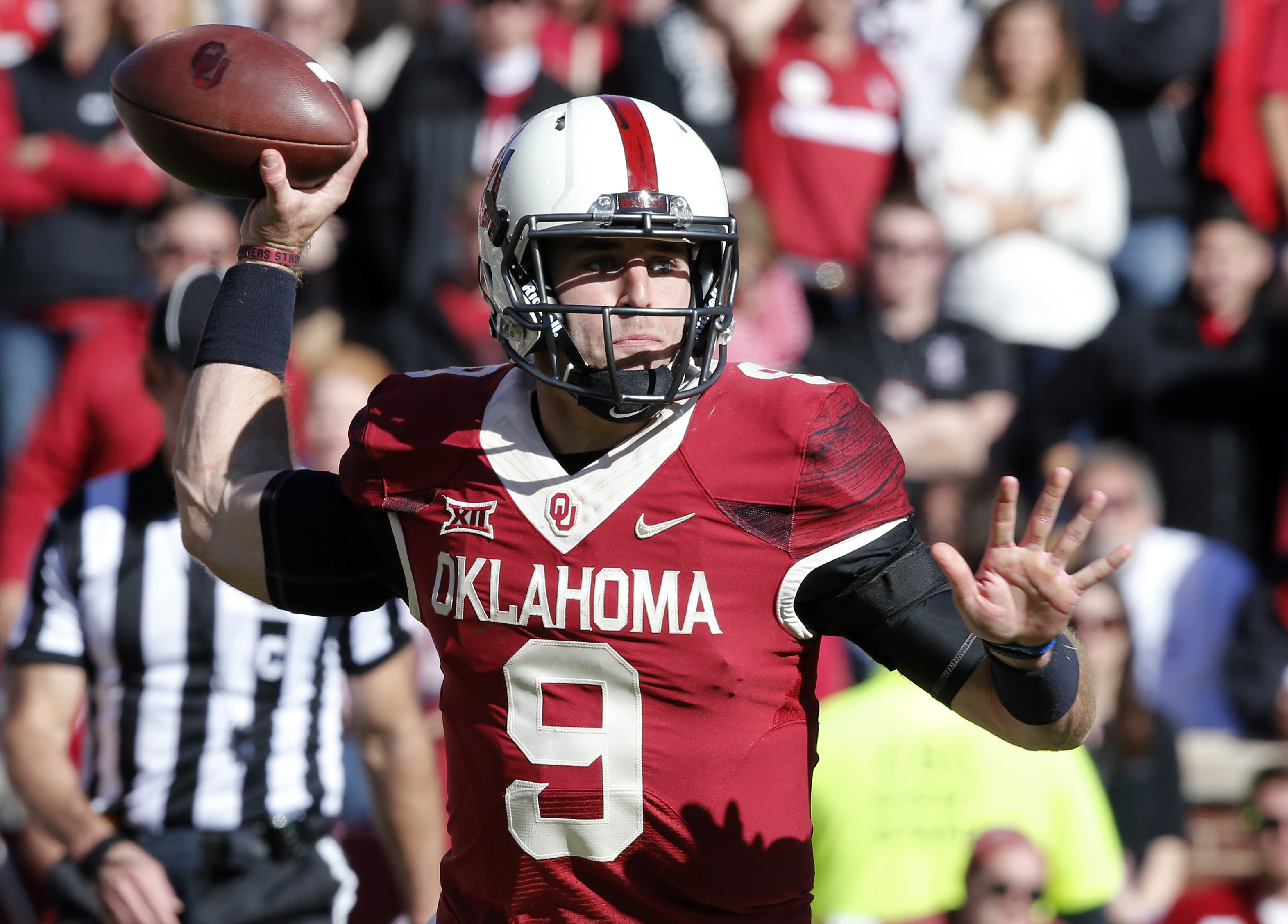 Oklahoma quarterback Trevor Knight (9) passes in the third quarter of an NCAA college football game against Baylor in Norman, Okla., Saturday, Nov. 8, 2014. Baylor won 48-14. (AP Photo/Sue Ogrocki)