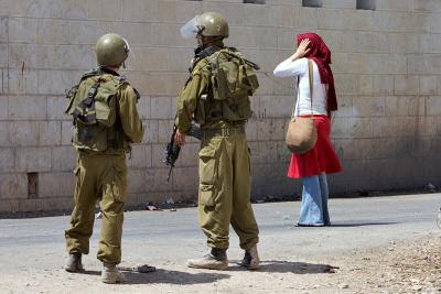 Israeli Activist and Soldiers in Palestinian Village