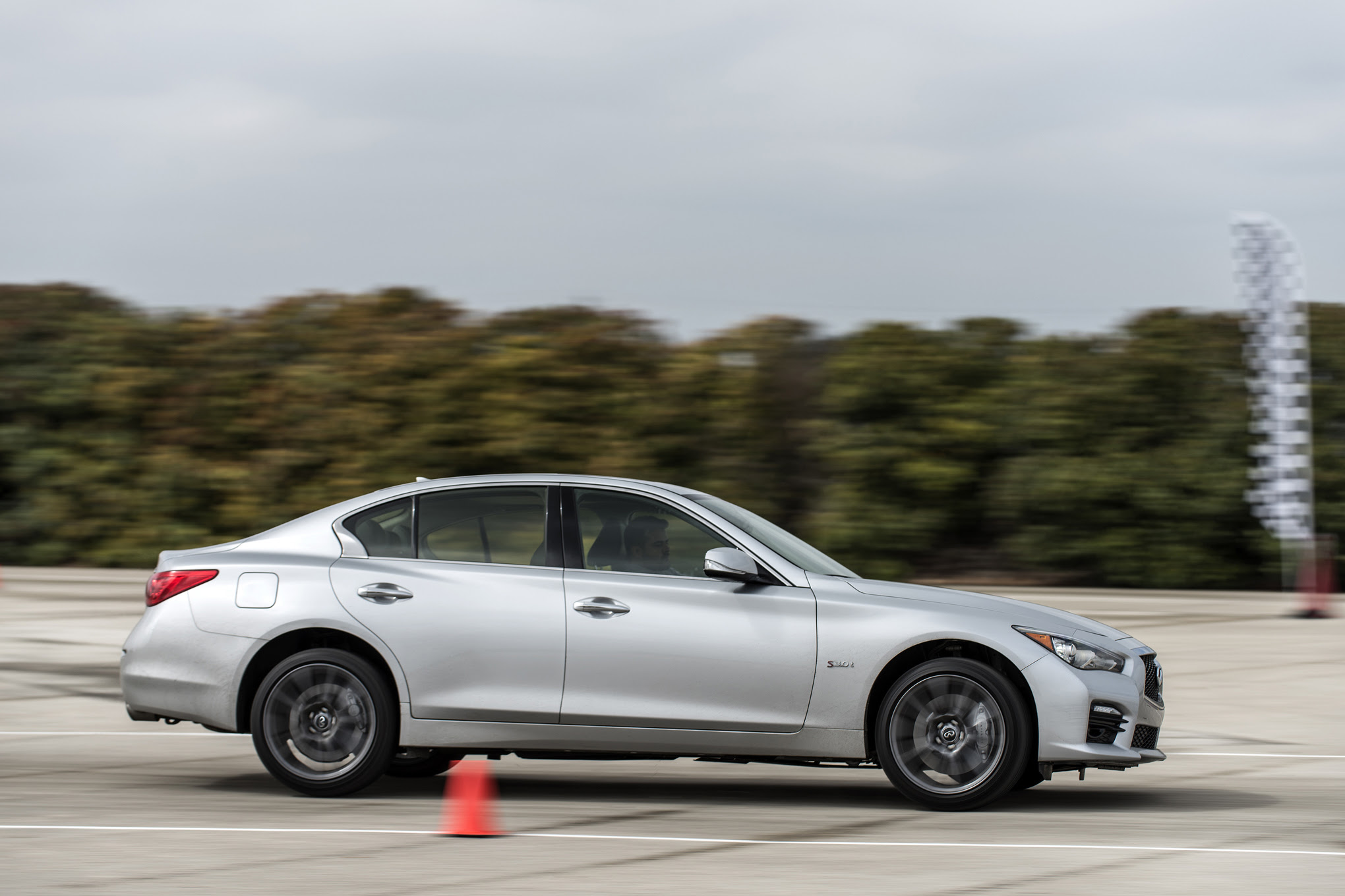 2016 Infiniti Q50 Red Sport 400 side in motion 02