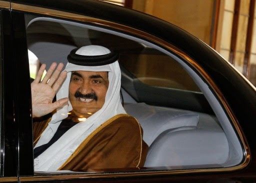 Qatar's emir, Sheikh Hamad bin Khalifa al-Thani, waves goodbye to Britain's Queen Elizabeth II and her husband Prince Philip (both not picture), as the leave on the final day of their State Visit, from Windsor Castle in Windsor, west of London, on October 28, 2010. AFP PHOTO / KIRSTY WIGGLESWORTH / POOL (Photo credit should read KIRSTY WIGGLESWORTH/AFP/Getty Images)