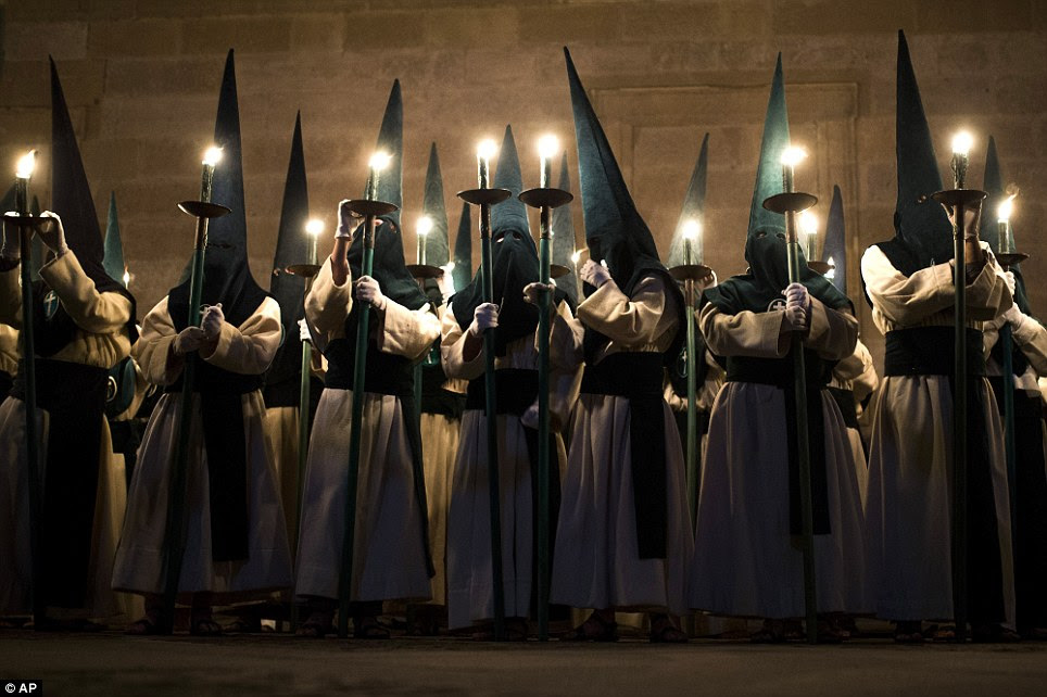 Penitents from 'Las Siete Palabras' - Seven Words - brotherhood take part in a procession in Zamora, Spain