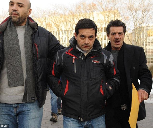 Gangster: Reputed Colombo family member Angelo Spata, centre, leaves Brooklyn federal court on bail 