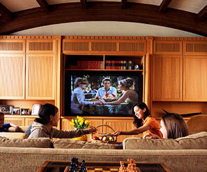 Three Girls watching Big Screen HDTV