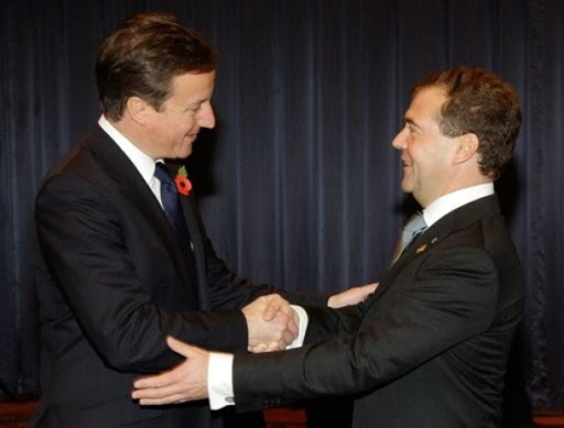 Russian President Dmitry Medvedev, right, greets Britain's Prime Minister David Cameron before their meeting on the sidelines of the G20 summit in Seoul, South Korea, Thursday, Nov. 11, 2010. (AP Photo/RIA Novosti, Dmitry Astakhov, Presidential Press Service)