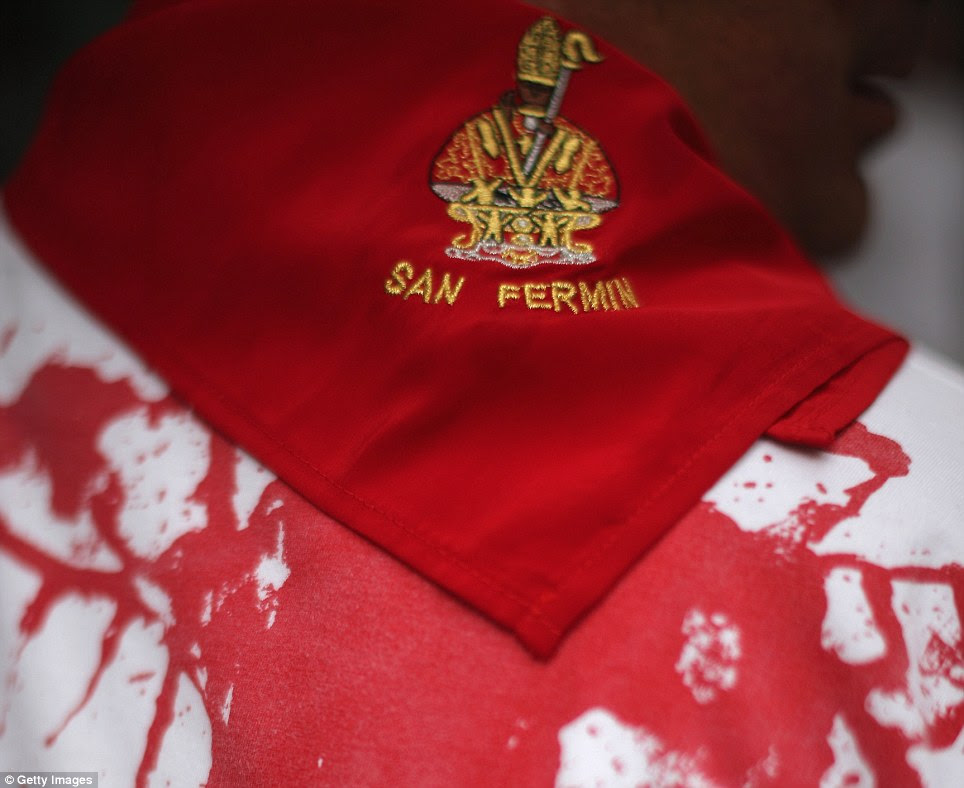 Patron saint: The celebrations see Pamploneses - locals of Pamplona - wearing neck ties in blood red