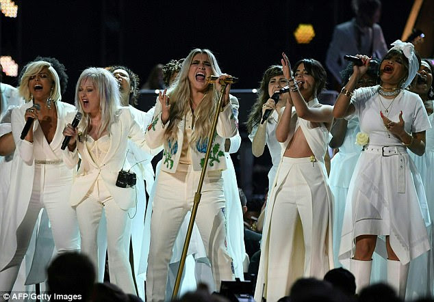 Powerful: Kesha was joined by Cindy Lauper and Camilla Cabello for an emotional Grammys performance of her song 'Praying' -  which deals with the effects of the abuse she suffered at the hands of 'Dr Luke' Gottwald