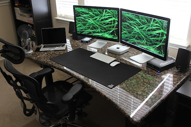 Mac Mini with dual Thunderbolt 27" Displays and a MacBook Pro Retina desk setup