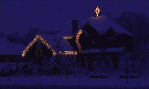 A GIF of a house decorated with lights for the holiday season