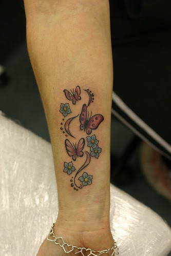 butterflys and flowers tattoo on wrist 