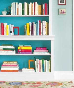 Borrow a trick from interior designers: Inside a bookcase, use paint that’s a couple shades deeper than the room color.