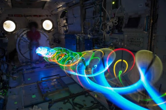On Expedition 27 in May 2011, NASA astronaut Cady Coleman participated in the Auroral Oval Spiral Top experiment. Credit: NASA