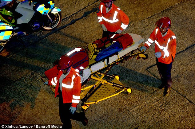 Mission: Rescuers bring equipment to the scene where a ferry carrying more than 120 people sank after colliding with another vessel