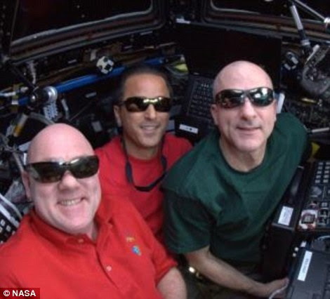 Dream team: On the left is a crew shot taken during Expedition 31 some days before they captured the first SpaceX Dragon commercial spacecraft. On the left is Andre Kuipers, centre is Joe Acaba and right, Don Pettit. The right image shows the team posing onboard the ISS