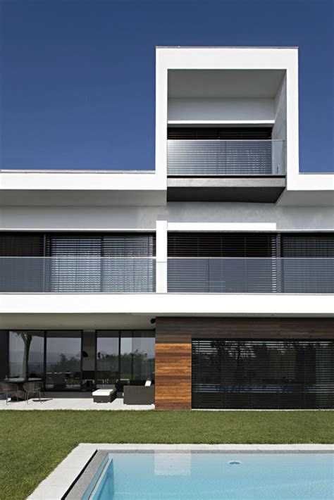 Your mind is buzzing with ideas, but you're not quite sure ho. White Concrete Three-Storey House - CS House by Pitagoras
