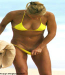 Anna Kournikova pulling off bikini bottom