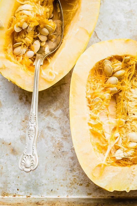 This easy, cheesy baked spaghetti squash is a healthier take on mac and cheese! It's cheesy, loaded with vegetables and feels like comfort food, without the calories and carbs.