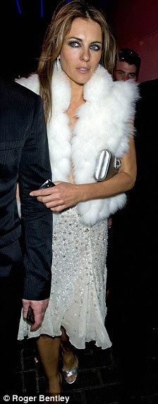 Silver sirens: Trinny Woodall dazzled in her filigree dress while Liz Hurley's diamantes sparkled on hers