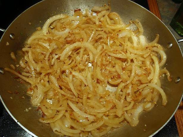 onions, red pepper flake, and garlic sweating