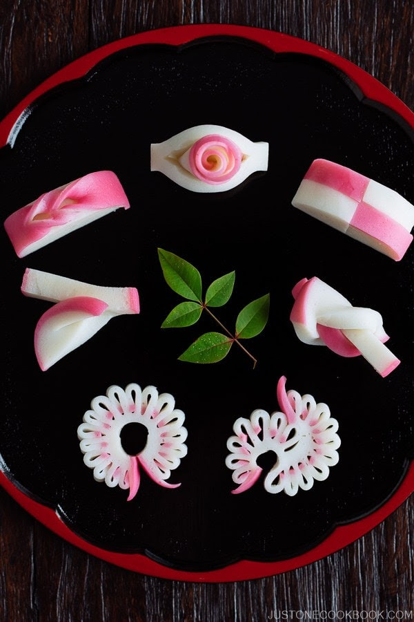 7 kinds of Decorative Kamaboko (Japanese Fish Cake) on a Japanese lacquer plate.
