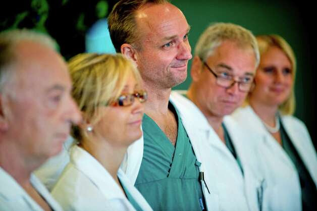 From left specialist surgeons Andreas G Tzakis, Pernilla Dahm-Kahler, Mats Brannstrom, Michael Olausson and Liza Johannesson attend a news conference Tuesday Sept. 18, 2012 at Sahlgrenska hospital in Goteborg Sweden. Two Swedish women are carrying the wombs of their mothers after what doctors called the world’s first mother-to-daughter uterus transplants.  The specialists at the University of Goteborg completed the surgery over the weekend without complications, but say they won’t consider the procedures successful unless the women achieve pregnancy after their observation period ends a year from now.  (AP Photo/Adam Ihse) SWEDEN OUT Photo: ADAM IHSE  / AL