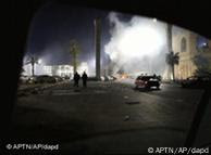 A fire burns on a street in Tripoli