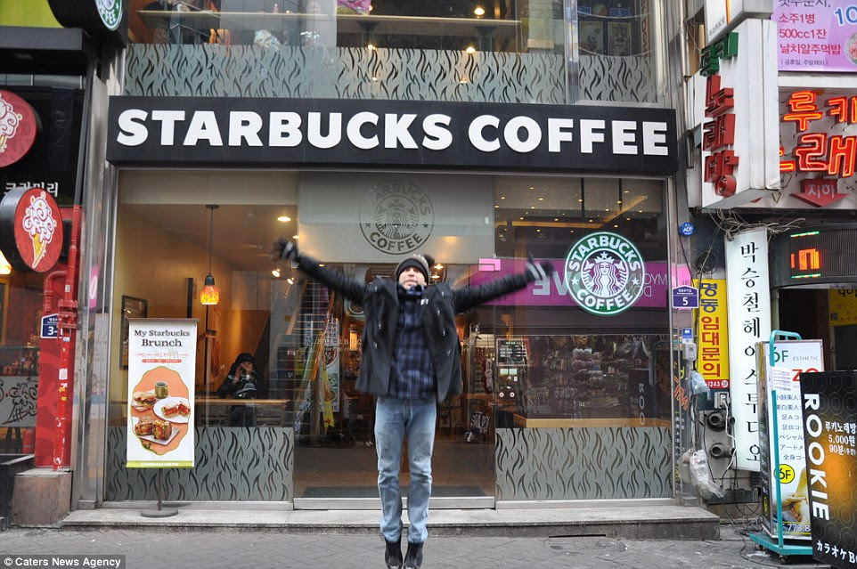 Full of beans: RafaelÂ Lozano pictured outside a Starbucks inÂ Myeongdong in Seoul, South Korea, on his mission to visit every outlet in the world