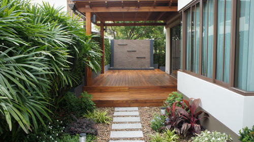 Gold Teak Deck with Modern Water-Wall Feature - Tropical ...