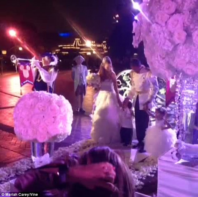 A family affair: The quartet held hands as they made their way down the aisle in front of friends and relatives