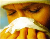 Woman sneezing