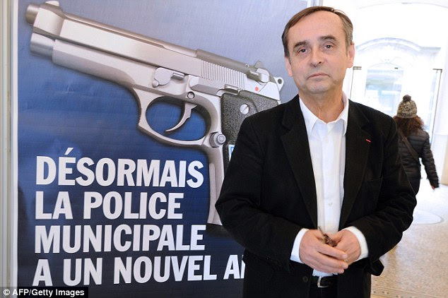 Mr Menard (pictured) is a former journalist who knows how to manipulate public opinion. He is seen in front of a poster which says: 'From now on, the Municipal Police has a new friend', which was unveiled when the police in Beziers were given new handguns