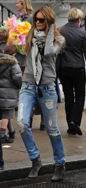 elle macpherson in a comfy sweater + scarf + ripped jeans