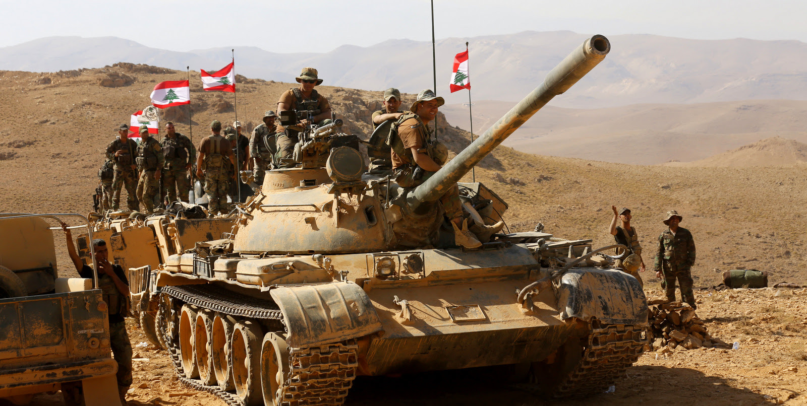 Lebanese soldiers rest on top of an armored personnel carrier on the outskirts of Ras Baalbek, Lebanon, Monday, Aug. 28, 2017. (AP/Hassan Ammar)