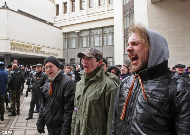 Yesterday Crimean citizens cheered as riot police from the pro-Russian Berkut brigade fled there, while in the West other were forced to knee on a stage and beg for forgiveness