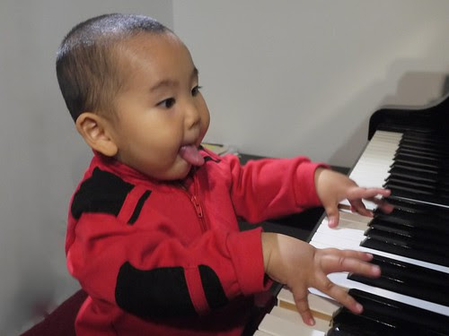 Happily practicing piano by LugerLA