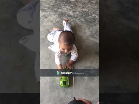 Cute Child tries to snatch a Toy Car