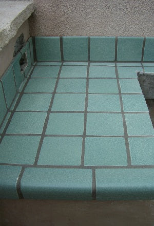 Finishing a tiled counter edge with a V-Cap trim tile