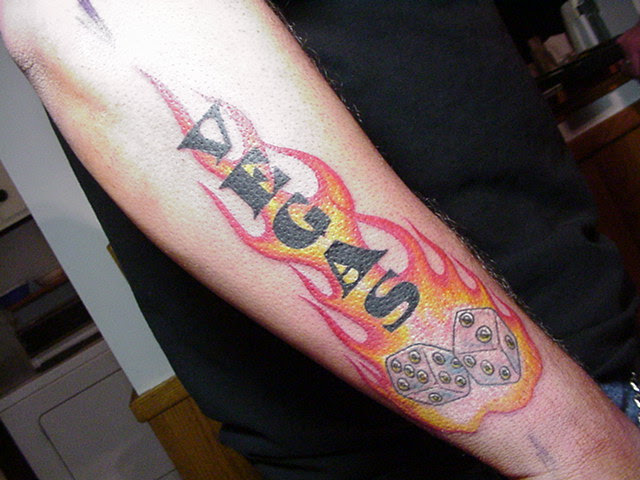  can gaze at one man's devotion to Las Vegas with a flaming dice tattoo.