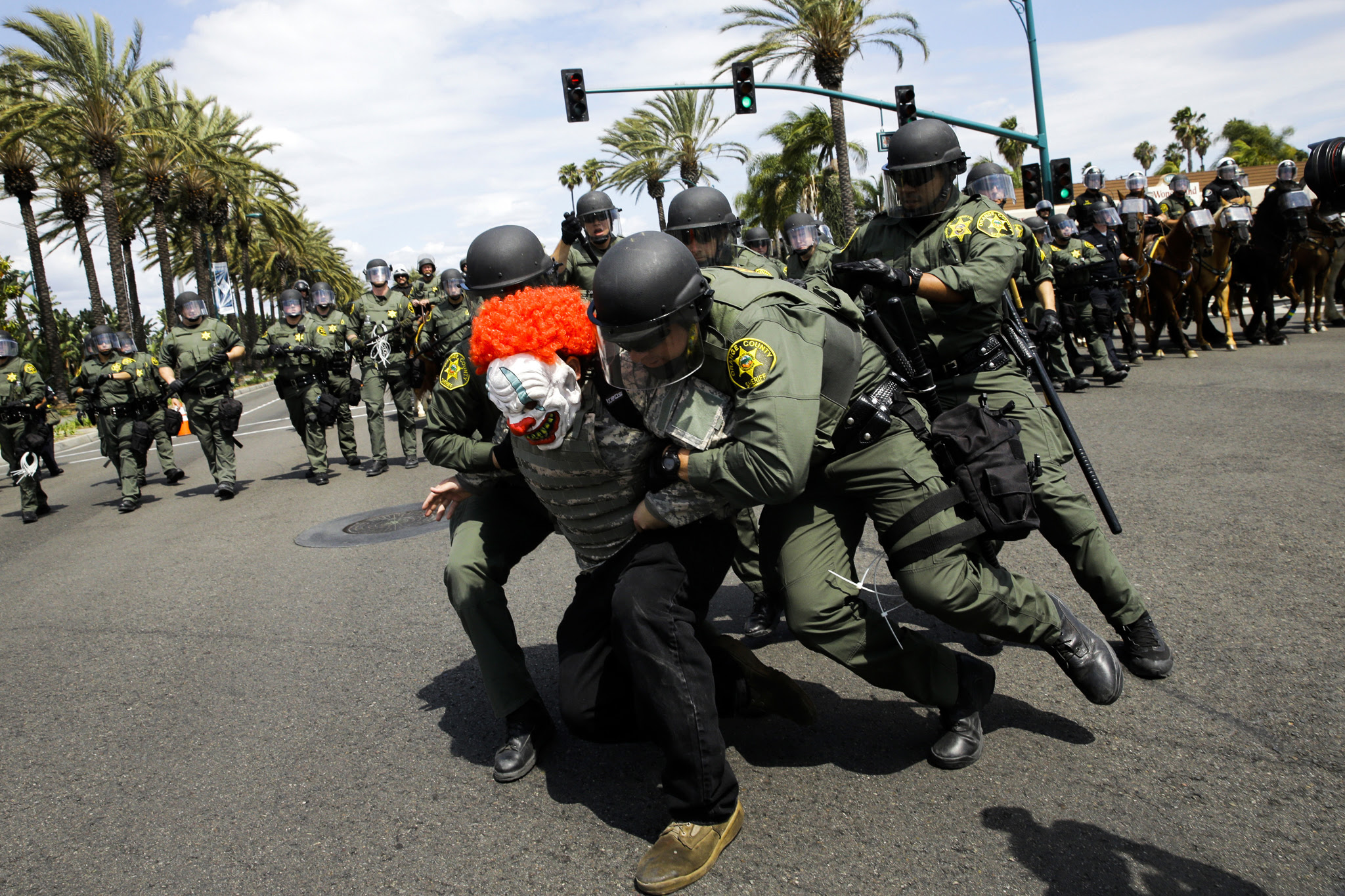 Orange County Sheriff's deputies take a protester into custody outside the Anaheim Convention Center where Republican presidential candidate Donald Trump held a rally
