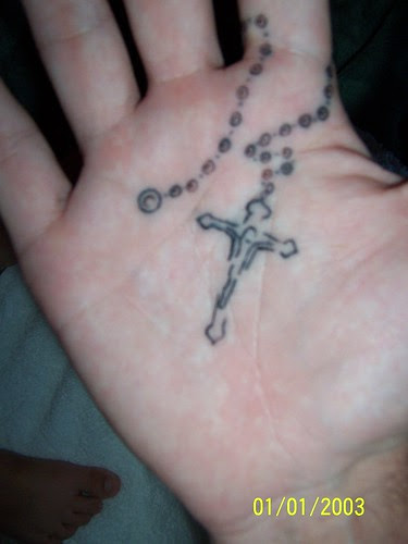 rosary beads tattoo. rosary tattoo on right hand