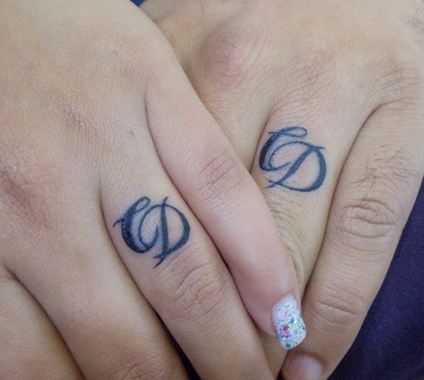 Love knot wedding ring tattoo