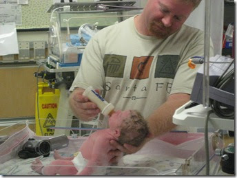 Dad feeds her first