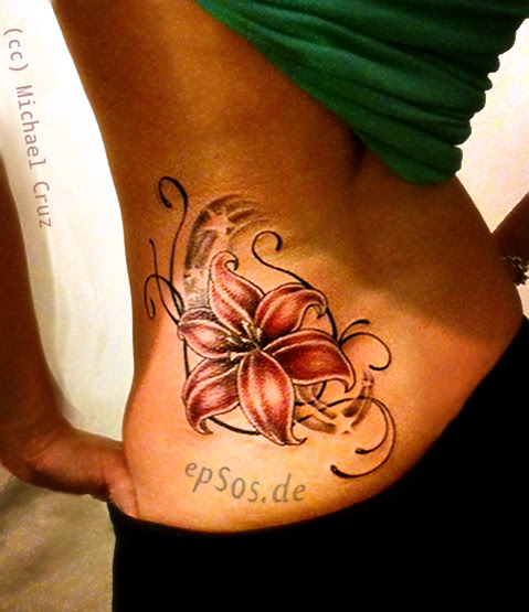 Lower Back Flower Tattoo Designs for Women