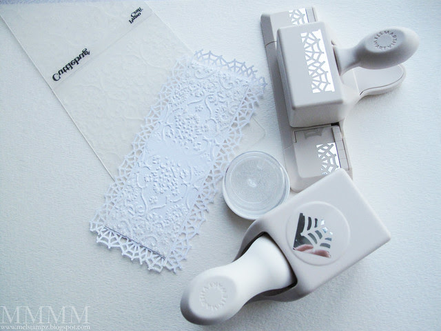 Punch spider web edge for a mat -Top with Cuttlebug embossed paper - Apply versamark heat & stick and glitter