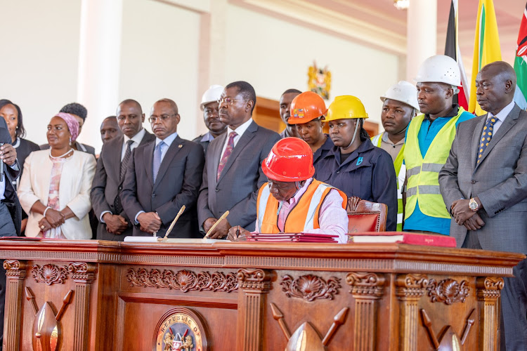 President William Ruto signing the Affordable Housing Bill 2023 to law at State House, Nairobi, on March 19, 2024.