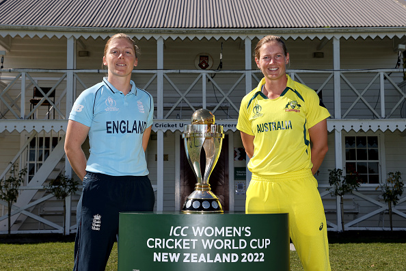 England captain Heather Knight (L) and her Australian counterpart Meg Lanning (R) pose with the World Cup Trophy ahead of the ICC Women's Cricket World Cup Final at Hagley Oval on Sunday.