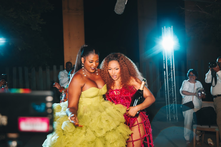 Enhle Mbali Mlotshwa and Shauwn Mkhize celebrating at the end of the runway show