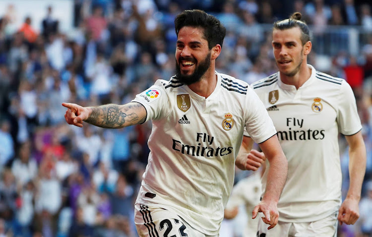 Real Madrid's Isco celebrates scoring their first goal.