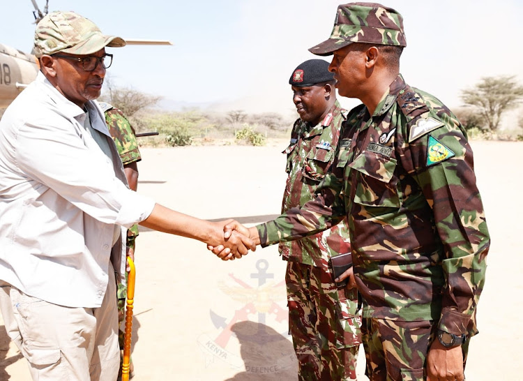 Defence cabinet secretary Aden Duale is received by some senior officers in charge of the operations in parts of the North rift on March 8, 2023.