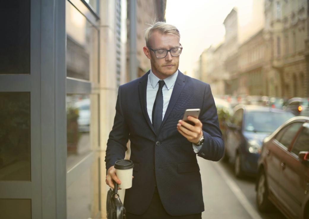 Man using an email app on their phone.