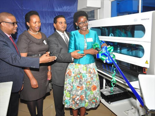 ACF Director Dorothy Ny'ongo, Roche country manager Rajen Bhimaraj, Director Women 4 Cancer Benda Kithaka and Pathologist Lancet Kenya Ahmed Kalebi unveiling the Cobas 4800 /COURTESY